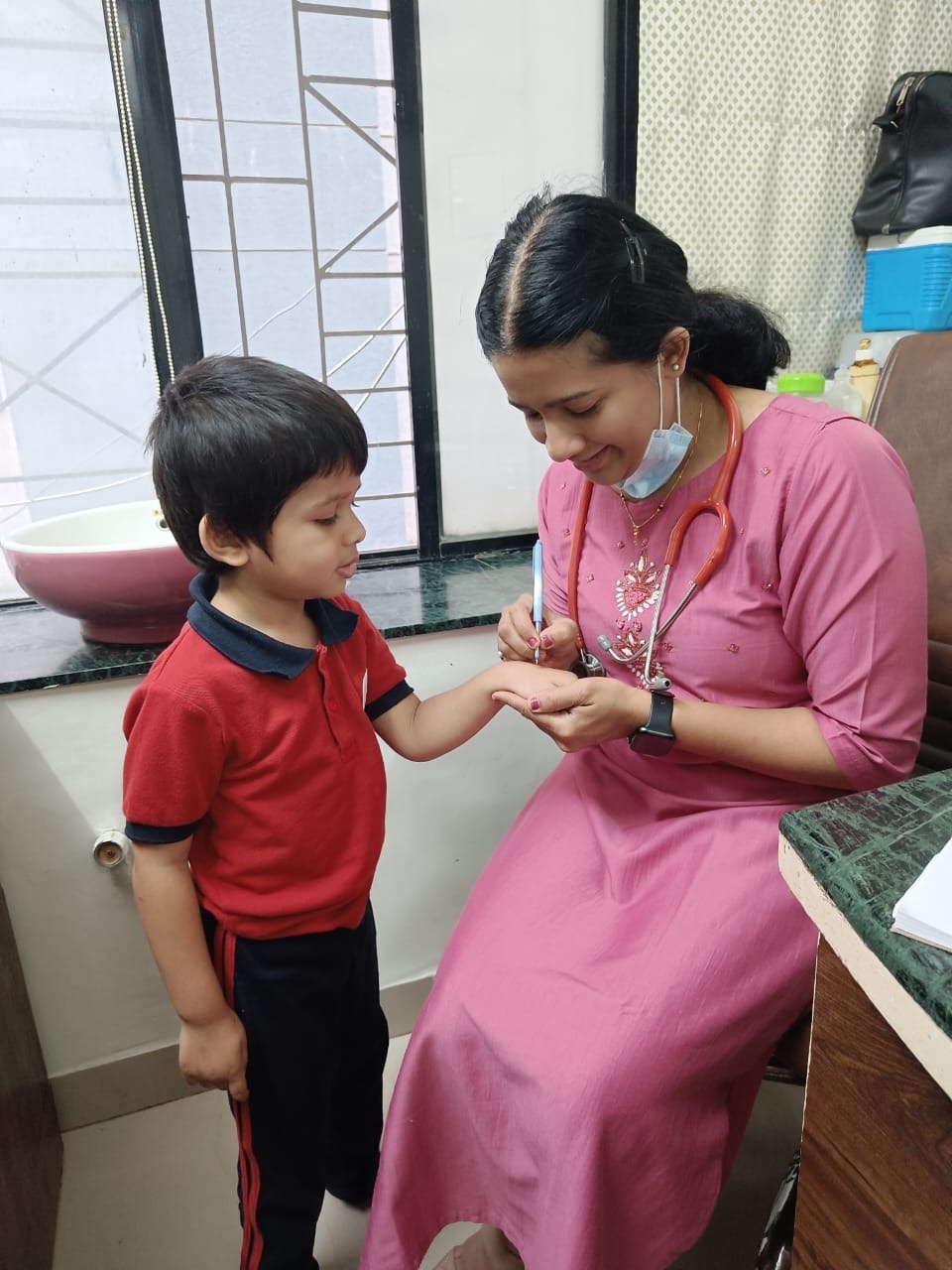 Dr. Archana caring for a child